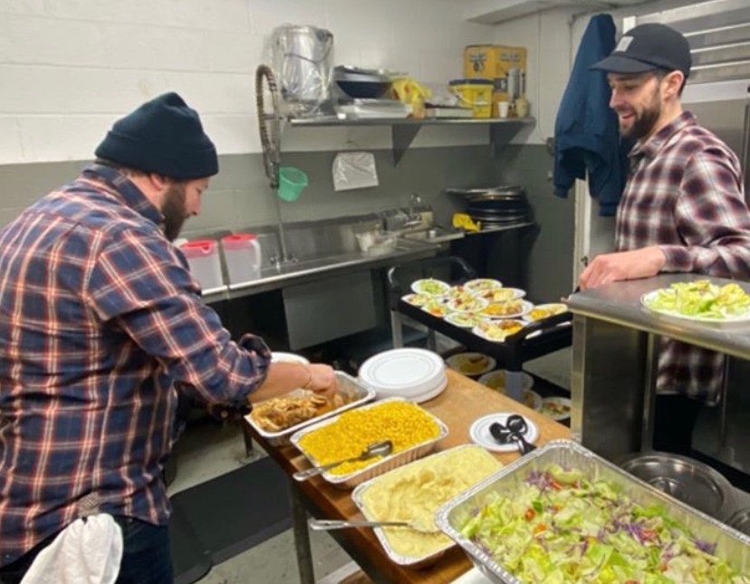 Nodar Mosiashivili and Matthew Trebek prepping for Lucille's Family Meal at St. Matthew's Baptist Church in Harlem, NY.