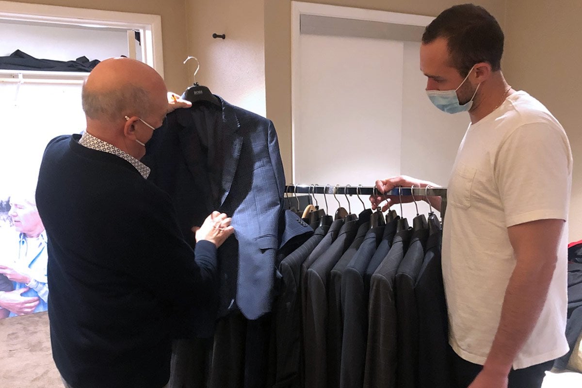 Steven Zimbelman and Matthew Trebek in Alex Trebek's dressing room at the Jeopardy! studios in Los Angeles preparing the shipment of Alex's wardrobe to The Doe Fund in NYC.